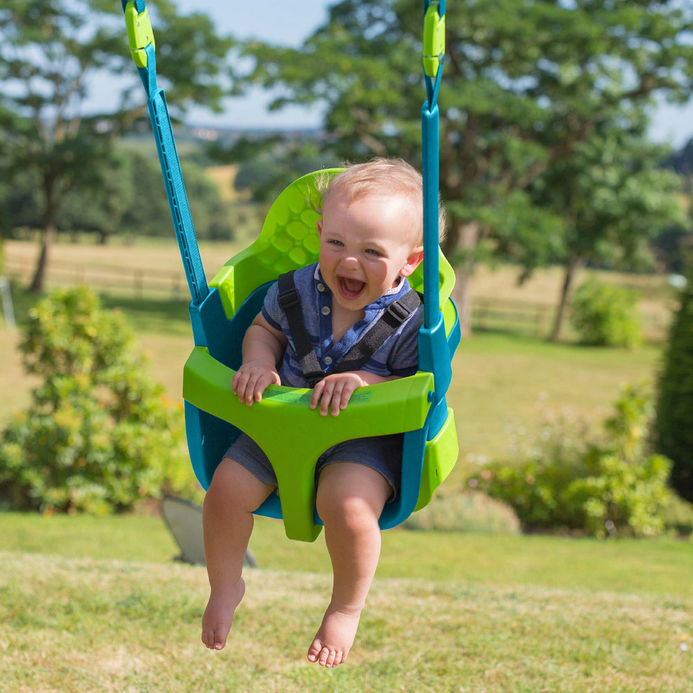 Child swinging in quadpod swing seat