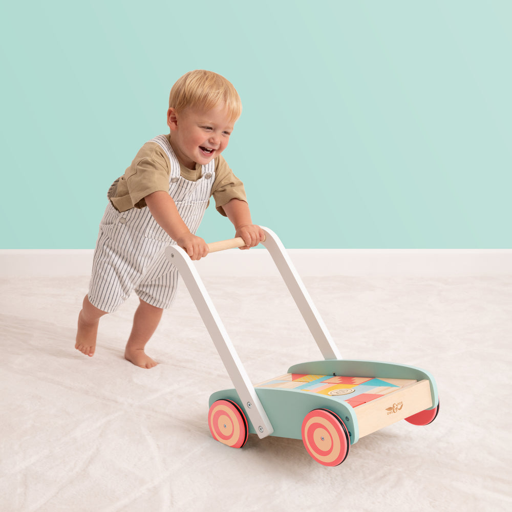 Child playing with wooden walker