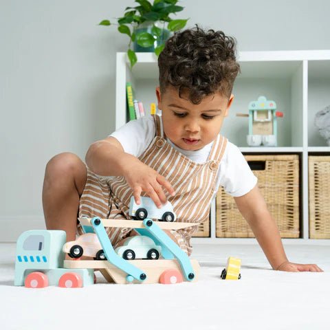  Child playing with wooden cars 