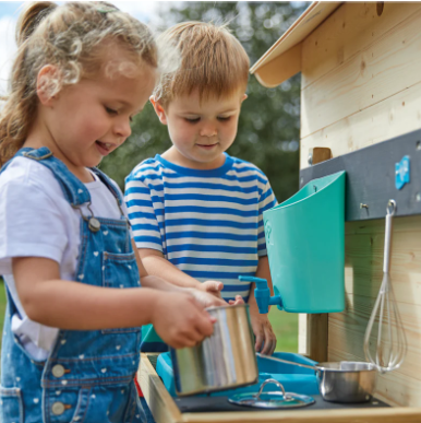  Children playing with mud kitchen 