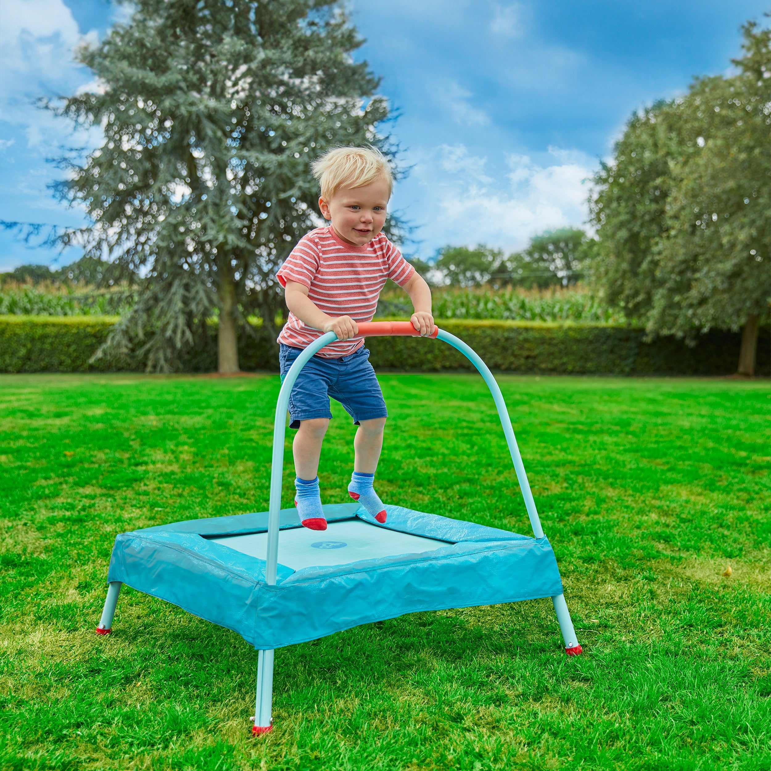  Child bouncing on toddler trampoline 