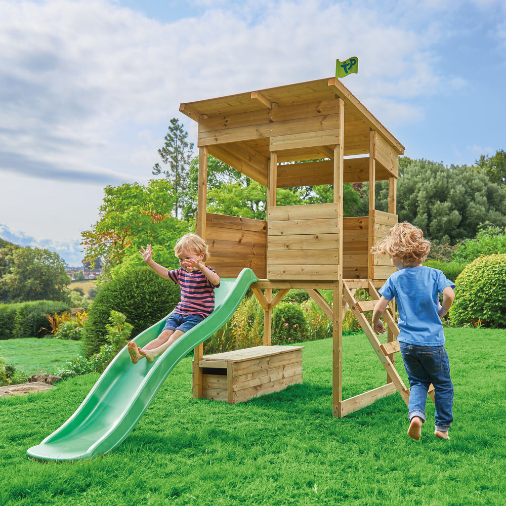 Children playing on garden slide set