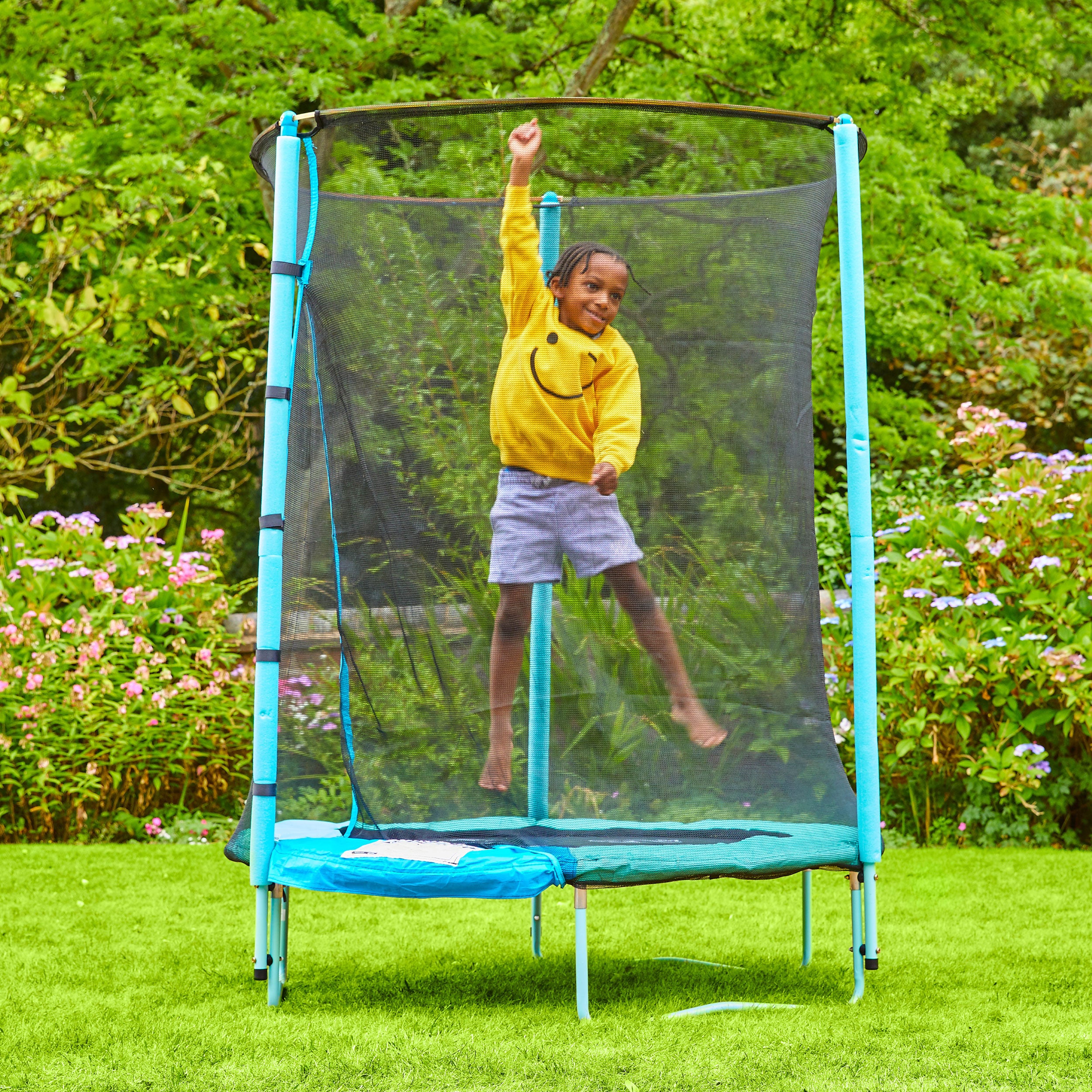  Child playing on outdoor trampoline 