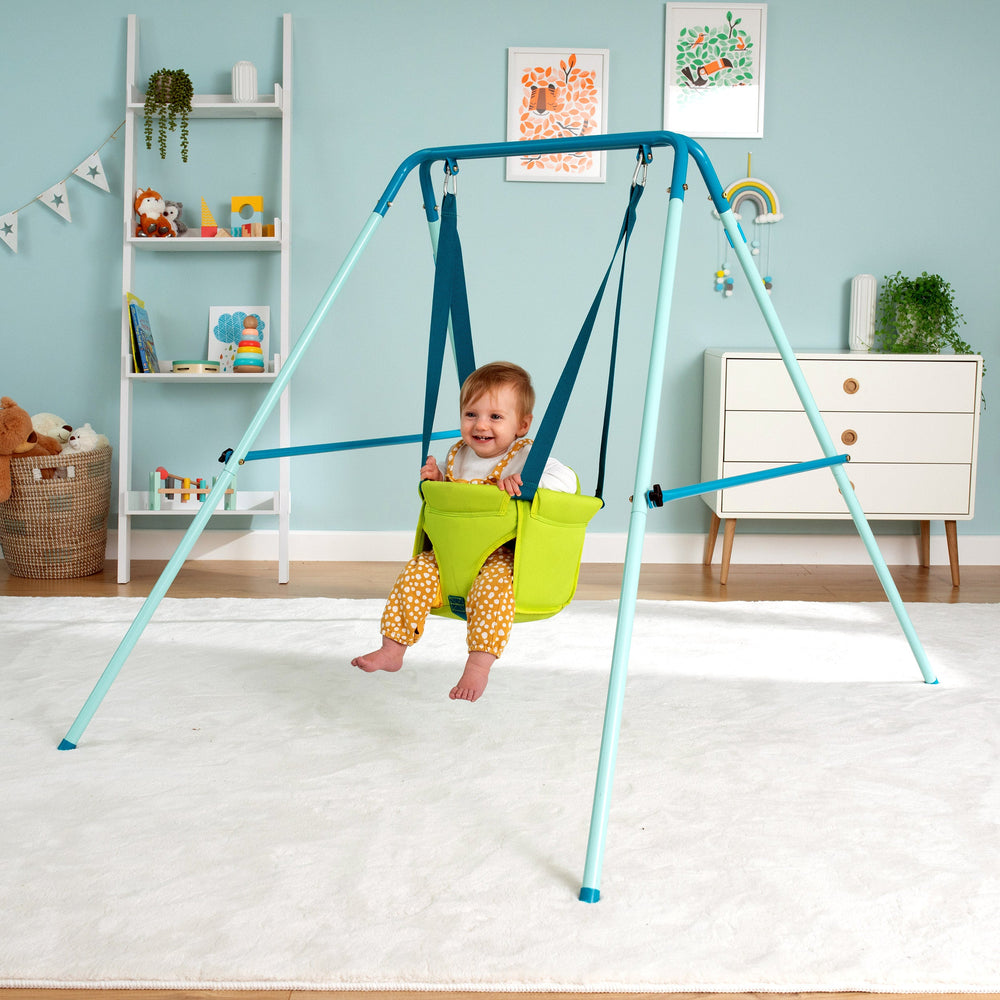 Child playing on foldaway baby swing