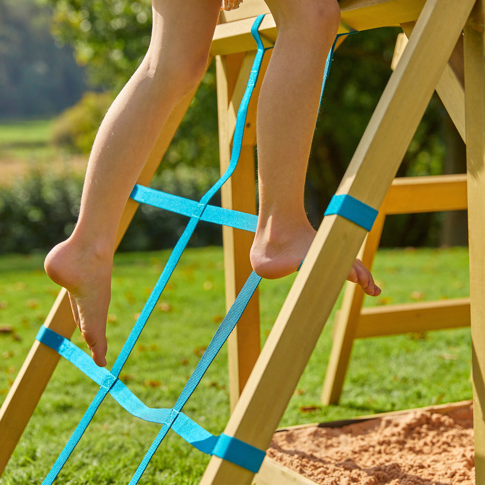 Child playing on climbing frame