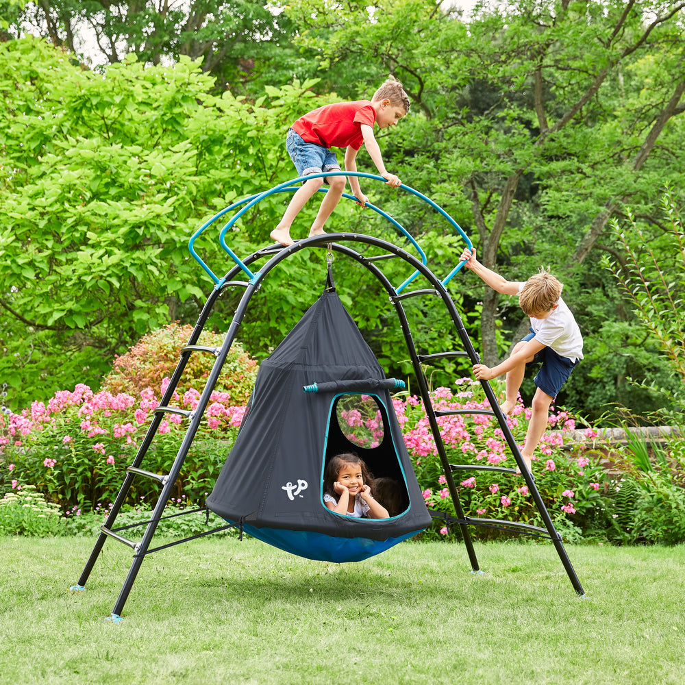 Children playing on metal climbing frame