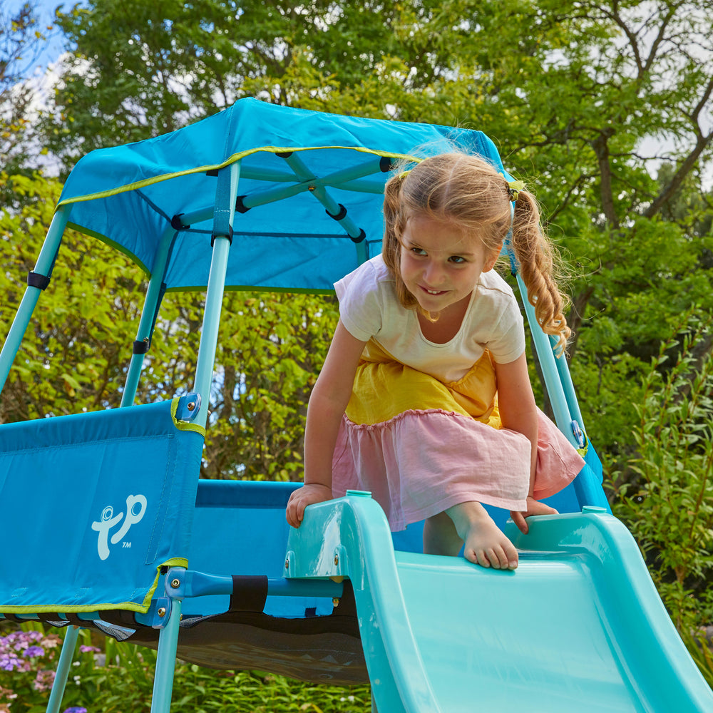 Child playing on outdoor slide